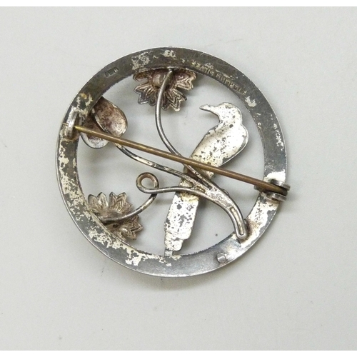 7061 - Ward Brothers, a Scottish silver brooch depicting a bird set with enamel, and two paste stones, 3.9c... 