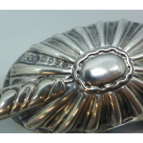 7037 - A Victorian silver backed brush, London, 1889, and a silver golf design spoon, 47g total