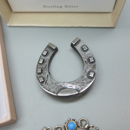 7038 - A silver pendant on chain in the form of a bee, a silver and white stone necklace and earrings, a si... 