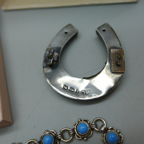 7038 - A silver pendant on chain in the form of a bee, a silver and white stone necklace and earrings, a si... 