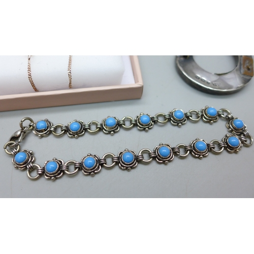 7038 - A silver pendant on chain in the form of a bee, a silver and white stone necklace and earrings, a si... 