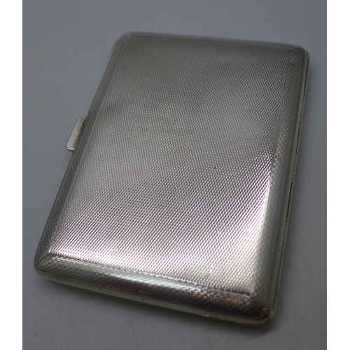 7042 - A silver cigarette case with green guilloche enamel decoration, silver import marks and personalised... 