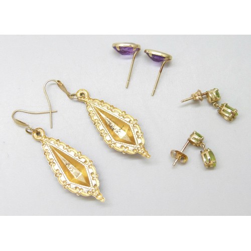 7054 - A pair of 9ct yellow gold and peridot earrings and two other pairs, total weight 2.3g