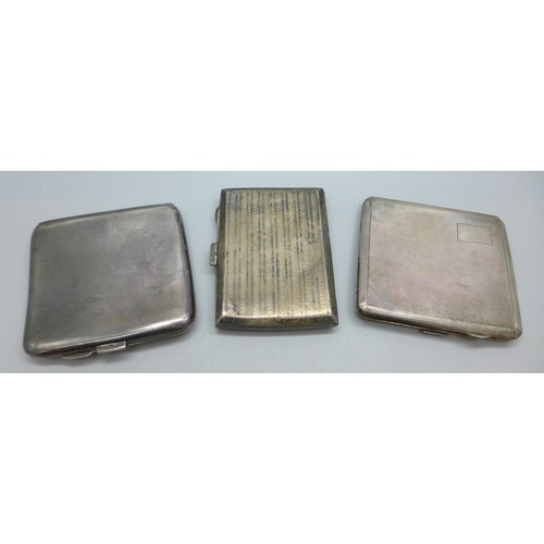 7047 - A collection of three silver cigarette cases, 218g total
