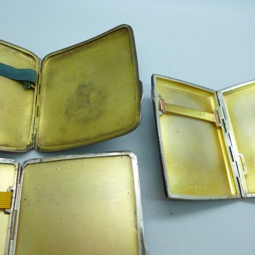 7047 - A collection of three silver cigarette cases, 218g total