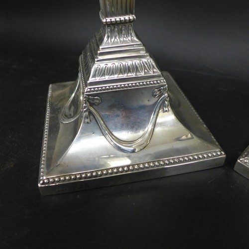 7050 - A pair of Victorian silver Corinthian column candlesticks with Neoclassical swag decoration, Hawkswo... 