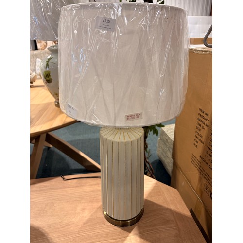 3011 - A cream and gold effect table lamp