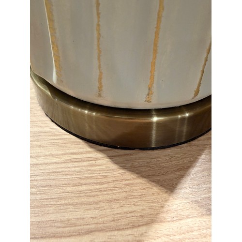 3011 - A cream and gold effect table lamp