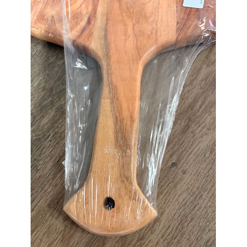 3042 - An acacia wood padel chopping board