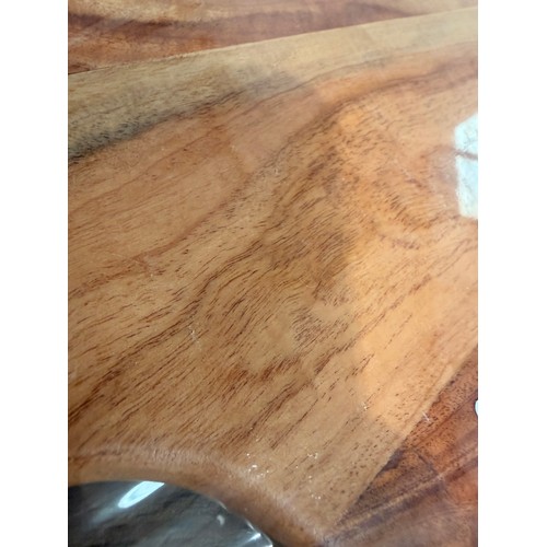 3042 - An acacia wood padel chopping board