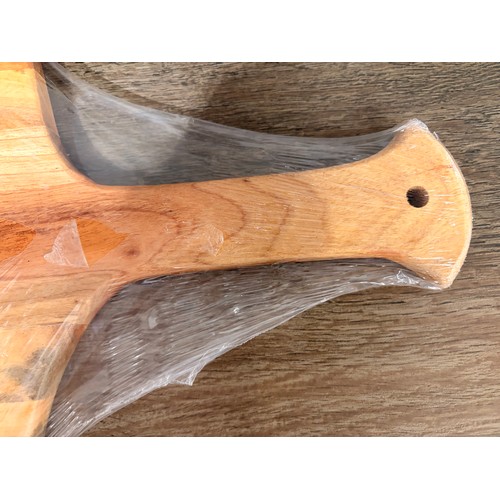 3044 - An acacia wood padel chopping board