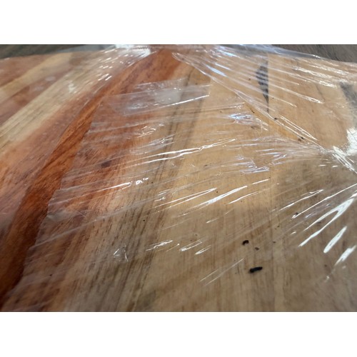 3044 - An acacia wood padel chopping board