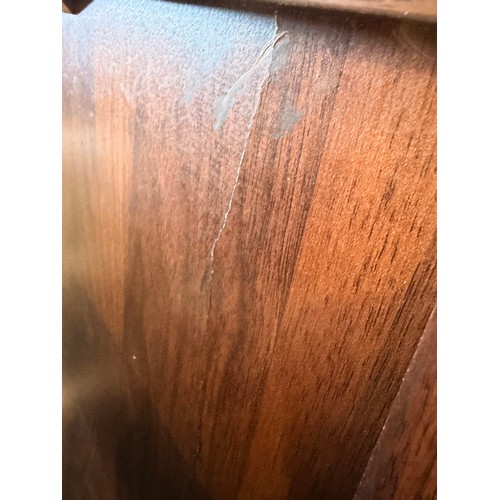 3064 - A curved walnut two door sideboard (marked)