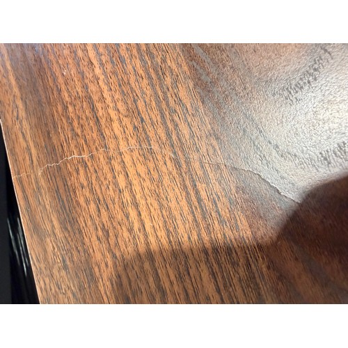 3064 - A curved walnut two door sideboard (marked)