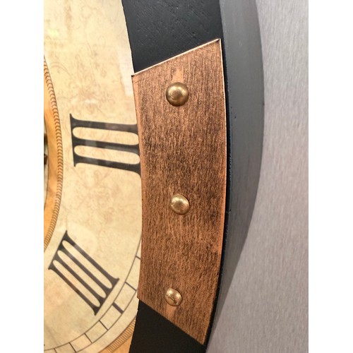3018 - A black framed 60cm moving gear wall clock with patterned face and brass effect accents