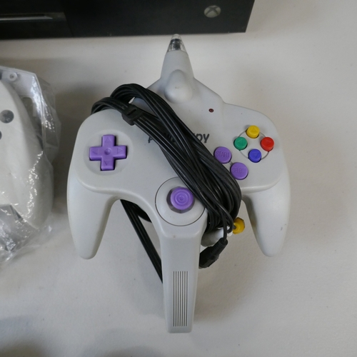 5007 - An XBox One games console, assorted games console controllers and a large quantity of games for Play... 