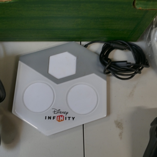 5007 - An XBox One games console, assorted games console controllers and a large quantity of games for Play... 