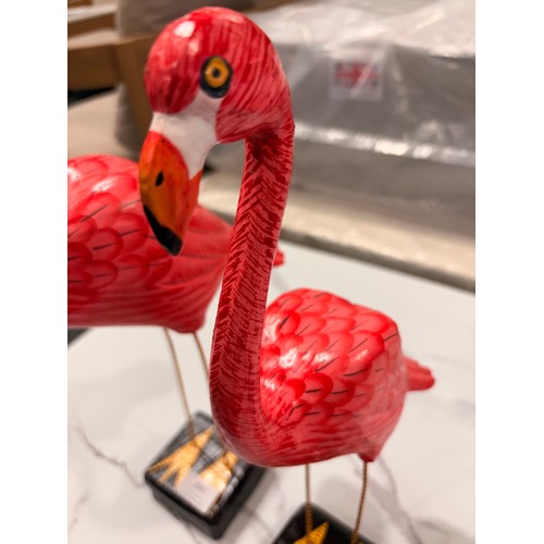 3067 - Three wooden standing flamingo ornaments