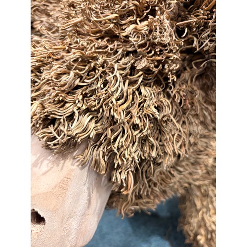 3096 - A Highland cow decoration made of wood and straw