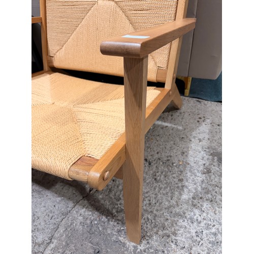 3102 - A Julian Brown Icaria chair with solid oak frame and woven seat pad and backrest