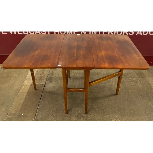 33 - A teak drop-leaf table