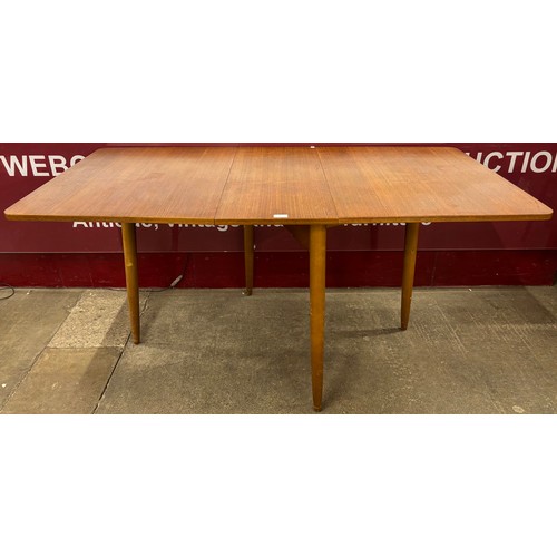 35 - A teak drop-leaf table