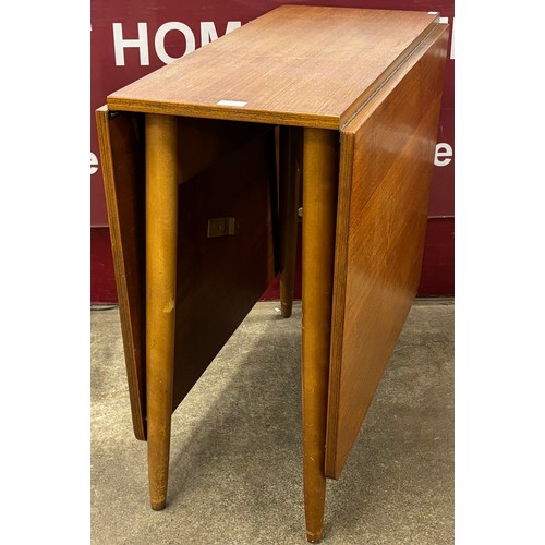 35 - A teak drop-leaf table