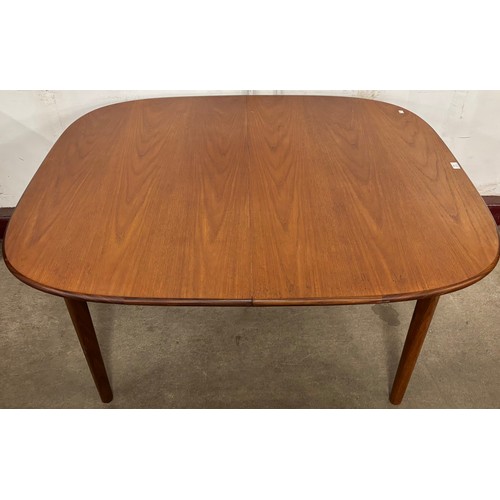 64 - A G-Plan teak oval extending dining table