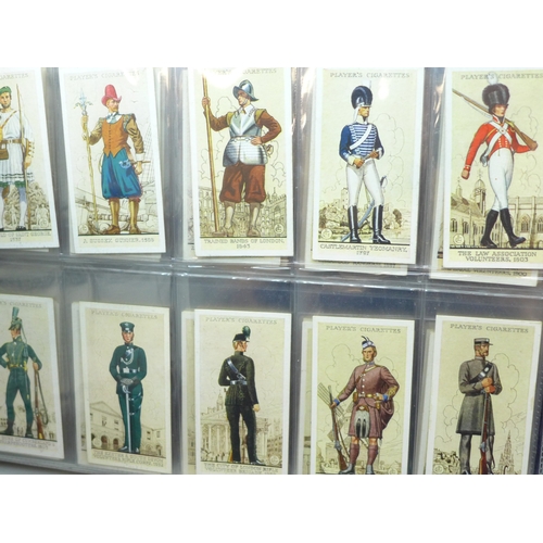 2037 - An album of cigarette card sets all complete, to include; John Player Drum Banners & Cap Badges, Joh... 