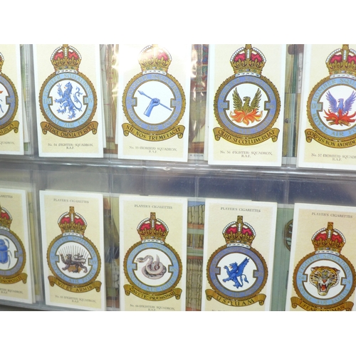 2037 - An album of cigarette card sets all complete, to include; John Player Drum Banners & Cap Badges, Joh... 
