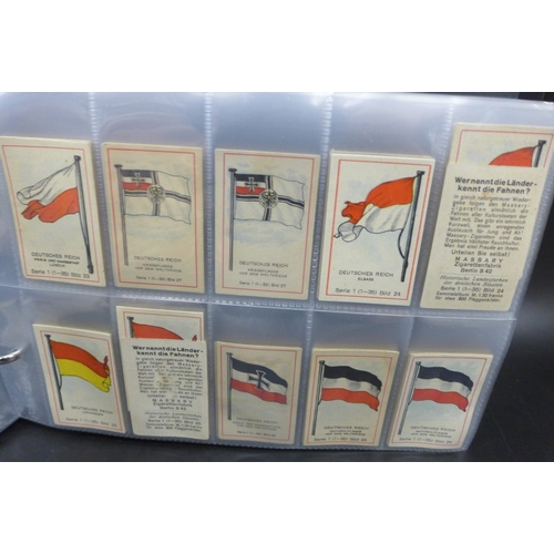 2043 - An album of assorted German Massary cigarette cards part sets of various series, all flags