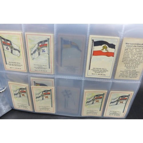 2043 - An album of assorted German Massary cigarette cards part sets of various series, all flags