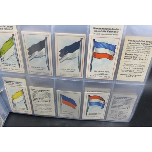 2043 - An album of assorted German Massary cigarette cards part sets of various series, all flags