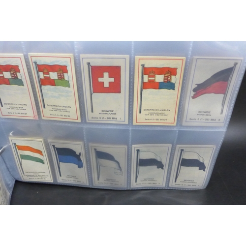 2043 - An album of assorted German Massary cigarette cards part sets of various series, all flags