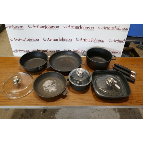 6017 - A quantity of Berghoff  Champion cookware,  (394-5) *This lot is subject to VAT