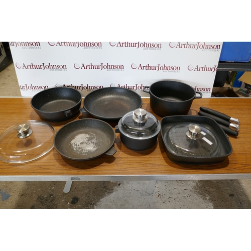 6017 - A quantity of Berghoff  Champion cookware,  (394-5) *This lot is subject to VAT