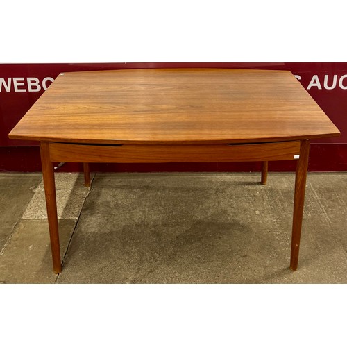 53 - A Danish teak extending dining table, attributed to Finn Juhl for Soren Willadsen