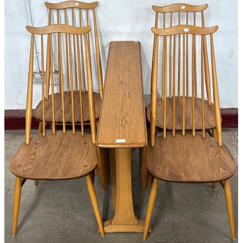75 - An Ercol Blonde elm and beech drop-leaf table and four Goldsmith chairs