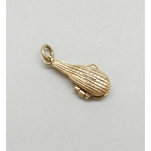 7008 - A 9ct gold charm in the form of a violin in a case, the case opens, hallmarked, 2g, 2.2cm including ... 