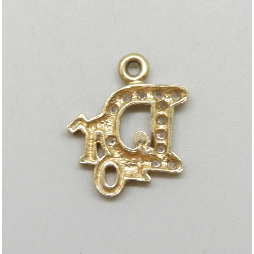 7012 - A yellow metal charm set with white stones, 2g, 1.8cm
