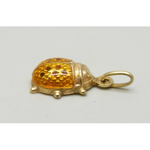 7014 - An Uno-Aerre Italian 9ct gold pendant set with yellow enamel in the form of a ladybird, 1g, 2.1cm