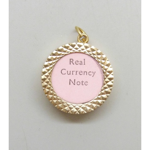 7020 - A 9ct gold £1 note charm, hallmarked, 3.4g, 2.4cm including loop
