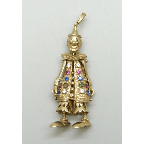7024 - A large statement 9ct gold articulated clown necklace pendant set with gemstones, one stone missing,... 