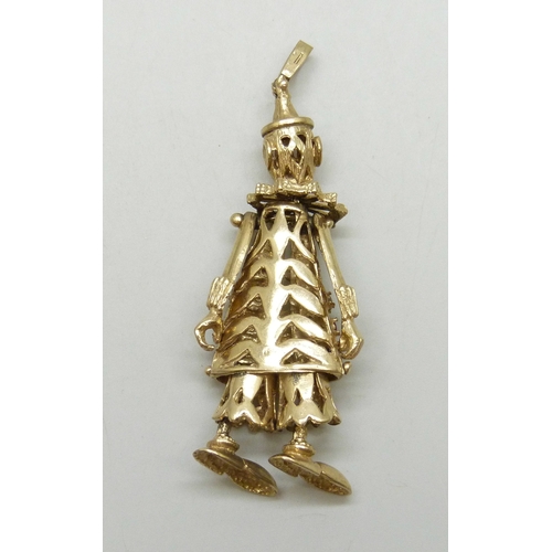 7024 - A large statement 9ct gold articulated clown necklace pendant set with gemstones, one stone missing,... 