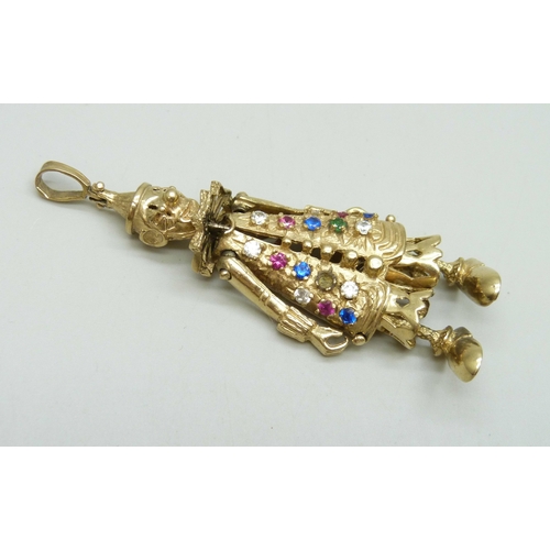 7024 - A large statement 9ct gold articulated clown necklace pendant set with gemstones, one stone missing,... 