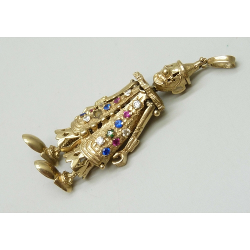 7024 - A large statement 9ct gold articulated clown necklace pendant set with gemstones, one stone missing,... 