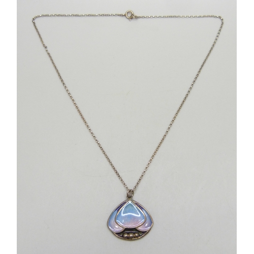 7028 - Pat Cheney, a Scottish silver and enamel Art Nouveau style necklace pendant on an unmarked chain, ha... 