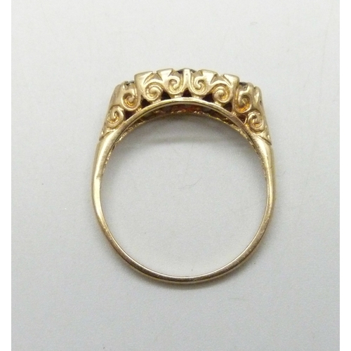 7031 - A 9ct gold, garnet and white stone ring, 2.5g, Q