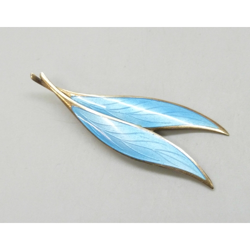 7033 - Scandinavian silver, Nilius Martinius Thune, a Norwegian silver gilt and blue enamel double leaf bro... 