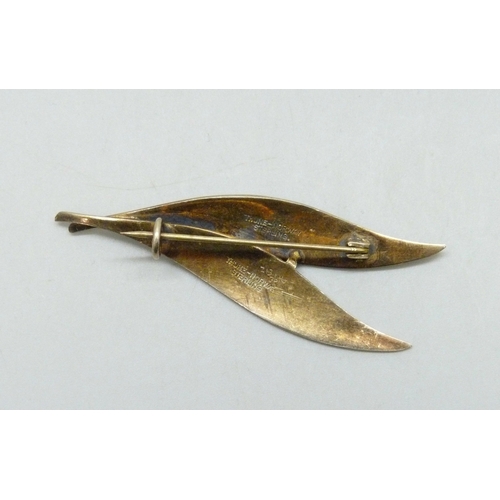 7033 - Scandinavian silver, Nilius Martinius Thune, a Norwegian silver gilt and blue enamel double leaf bro... 